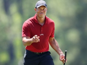 Tiger Woods of the United States acknowledges the crowd while walking to the 18th green during the final round of the 2024 Masters Tournament at Augusta National Golf Club on Sunday, April 14, 2024 in Augusta, Georgia.