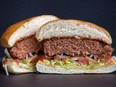 A cross section of a 'beyond burger' is displayed inside a TGI Friday's Inc. restaurant in Moscow, Russia, Sept. 27, 2019.