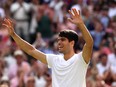 Carlos Alcaraz of Spain celebrates winning Championship point against Novak Djokovic of Serbia in the Men's Singles Final during day fourteen of The Championships Wimbledon 2024 at All England Lawn Tennis and Croquet Club on July 14, 2024 in London, England.