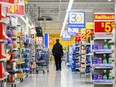 People shop at a Walmart in Vaughan, Ont., during sensory hours, which are select hours that accommodate people who want a quieter shopping experience, on Wednesday, July 2, 2024.