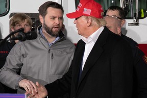 U.S. Senator JD Vance (left) shakes hands with former U.S. president Donald Trump during an event at the East Palestine Fire Department in East Palestine, Ohio, on Feb. 22, 2023.