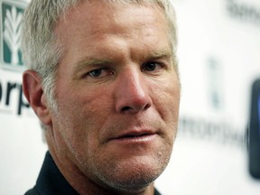 FILE - Former NFL football quarterback Brett Favre speaks with reporters prior to his induction to the Mississippi Hall of Fame, Aug. 1, 2015, in Jackson, Miss. A Mississippi judge on Thursday, July 11, 2024, removed one of the attorneys representing Favre in a civil lawsuit filed in 2022 by the Mississippi Department of Human Services, which seeks to recover welfare money that the state auditor says was misspent on projects including a university volleyball arena backed by Favre.