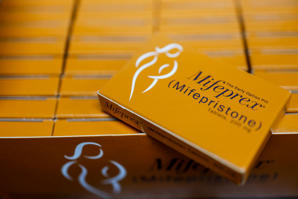 Packages of Mifepristone tablets are displayed at a family planning clinic on April 13, 2023, in Rockville, Maryland. (Photo illustration by Anna Moneymaker/Getty Images)