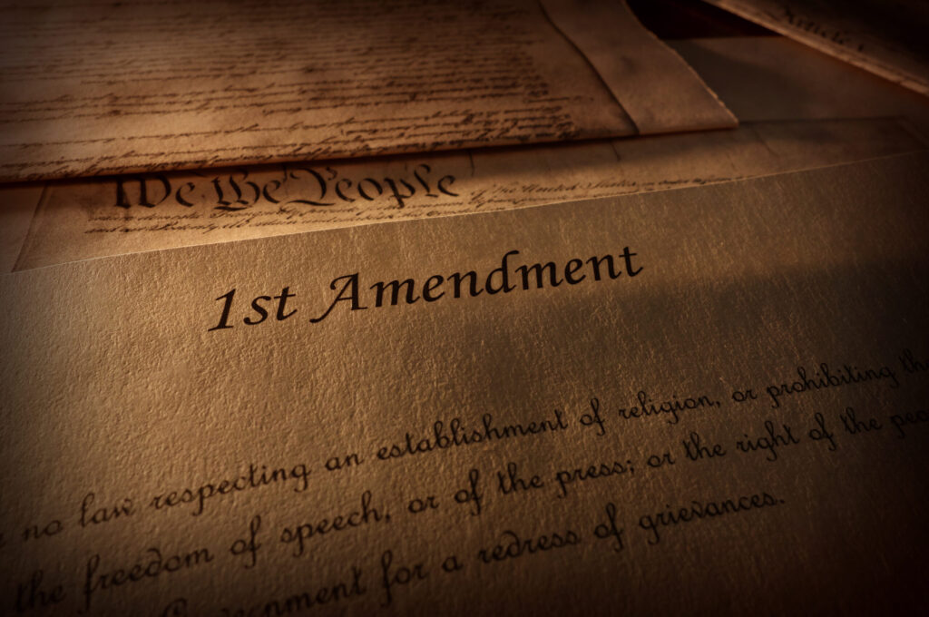 First Amendment of the US Constitution text, with other Constitution text above. (iStock/Getty Images Plus)