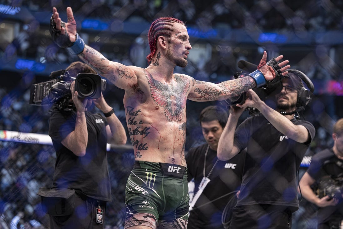 Oct 22, 2022; Abu Dhabi, UAE;  Sean O'Malley (blue gloves) defeats Petr Yan (red gloveS) during UFC 280 at Etihad Arena. Mandatory Credit: Craig Kidwell-USA TODAY Sports