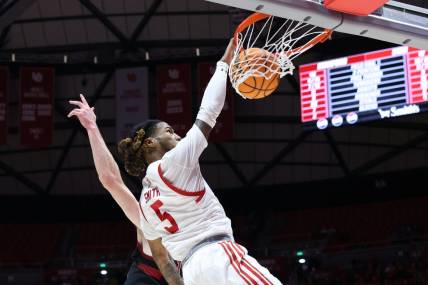 Feb 29, 2024; Salt Lake City, Utah, USA; Utah Utes guard Deivon Smith (5) dunks the ball against the Stanford Cardinal during the second half at Jon M. Huntsman Center. Mandatory Credit: Rob Gray-USA TODAY Sports