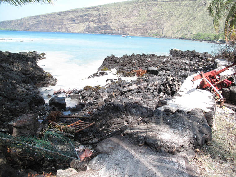 AARON NAGATA / SPECIAL TO THE STAR-ADVERTISER
                                Tsunami damage is seen near Kealakekua Bay on the Big Island on March 11, 2011.