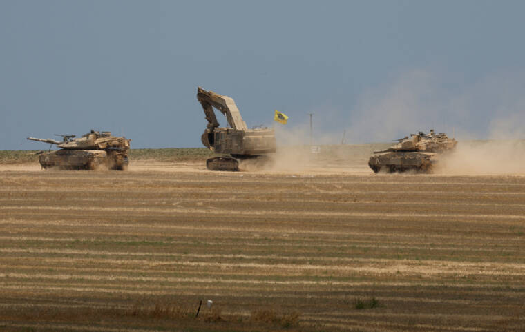 AMIR COHEN / REUTERS / MAY 14
                                Israeli tanks maneuver, amid the ongoing conflict between Israel and the Palestinian Islamist group Hamas, near the Israel-Gaza border in May .