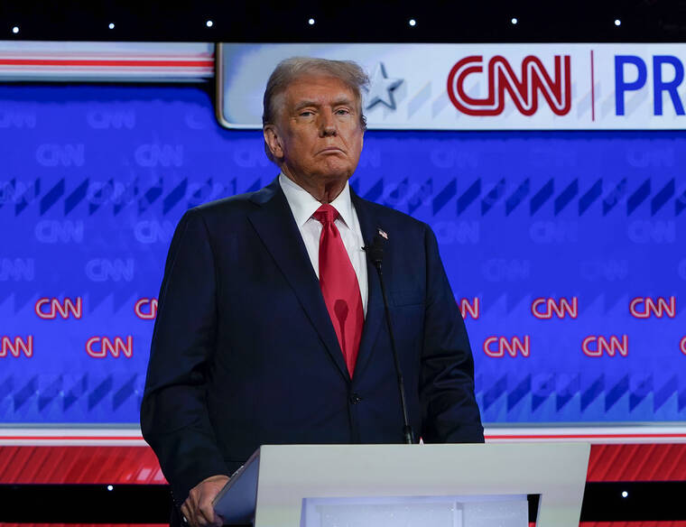 JACK GRUBER / USA TODAY
                                Former President Donald Trump, left, during the debate at CNN’s studios in Atlanta on June 27.