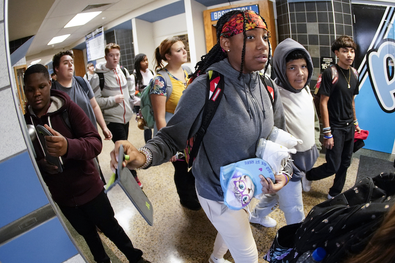 Students retrieve their cellphones.