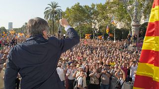 Catalan independence leader and former President Carles Puigdemont addresses supporters near the Catalan parliament in Barcelona, August 2024