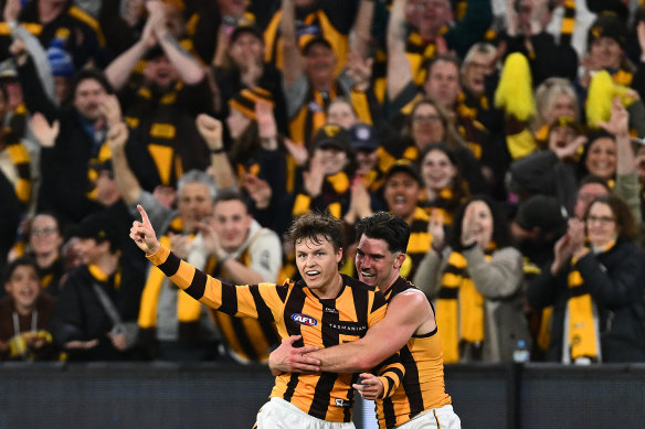 Jack Ginnivan of the Hawks is hugged by Jai Newcombe as they celebrate a goal in the final term.