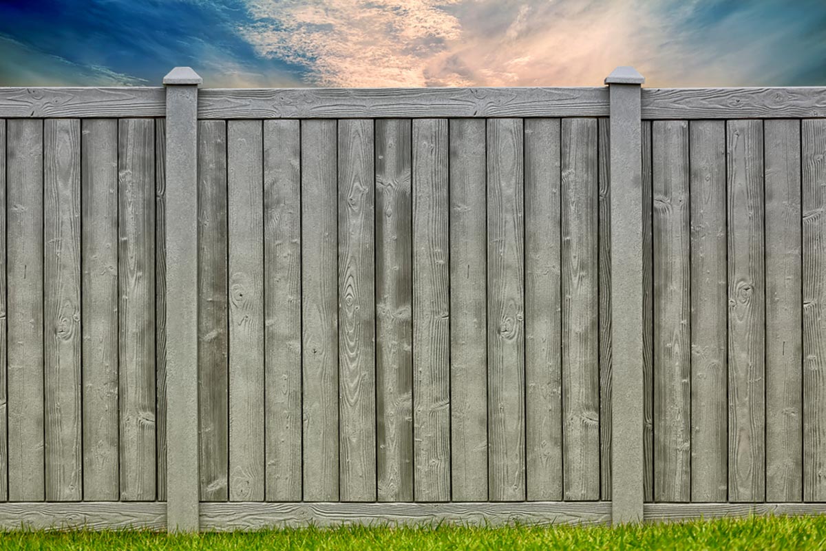 Gray composite fencing designed to look like wood