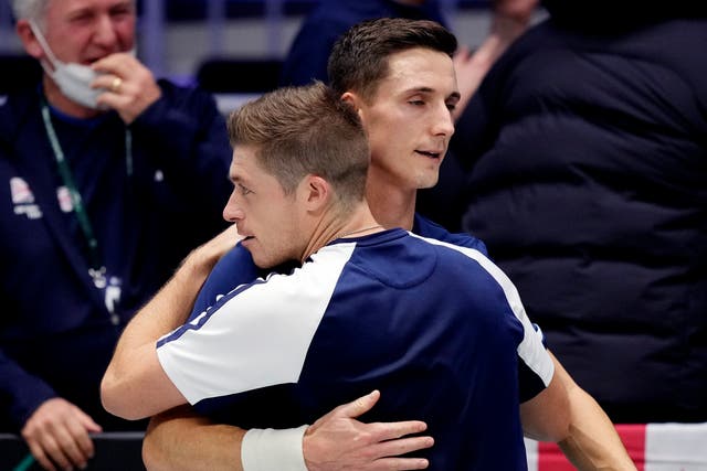 Joe Salisbury, right, and Neal Skupski celebrate after booking Britain’s spot in the quarter-finals (Michael Probst/AP)