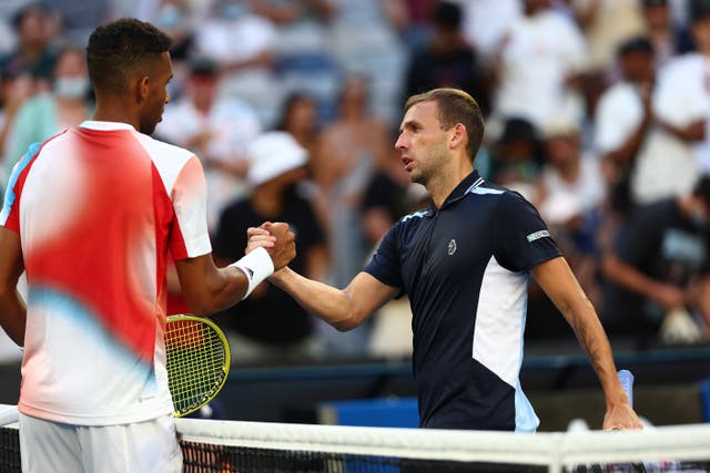 <p>Dan Evans congratulates Felix Auger-Aliassime</p>