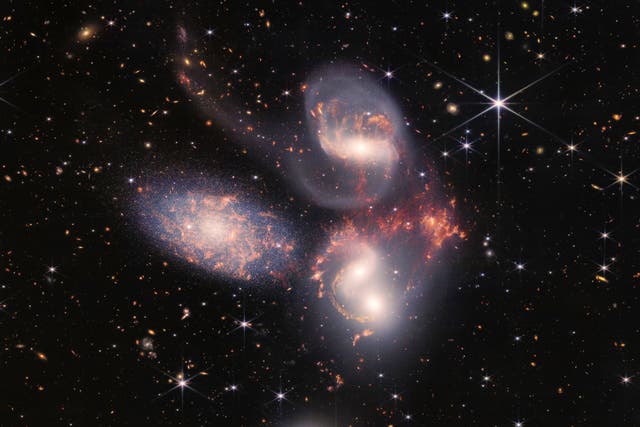 <p>Stefan’s Quintet, a visual collection of five distant galaxies, was one of the Webb Telescope’s first full-colour images</p>