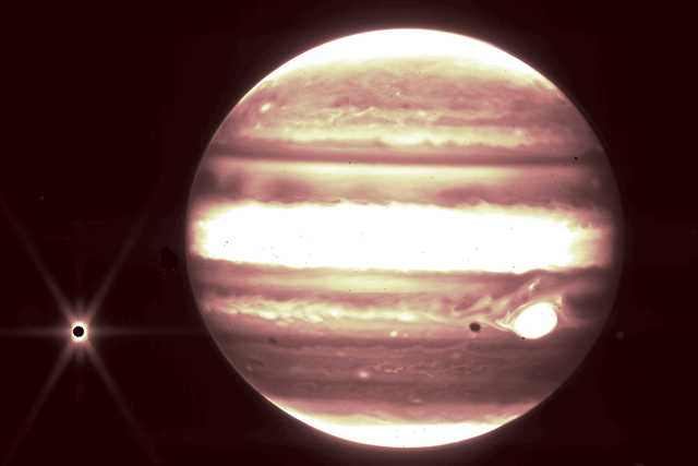 <p>Jupiter as seen in near-infrared light by the James Webb Space Telescope. The Jovian moon Europa is seen at left. </p>