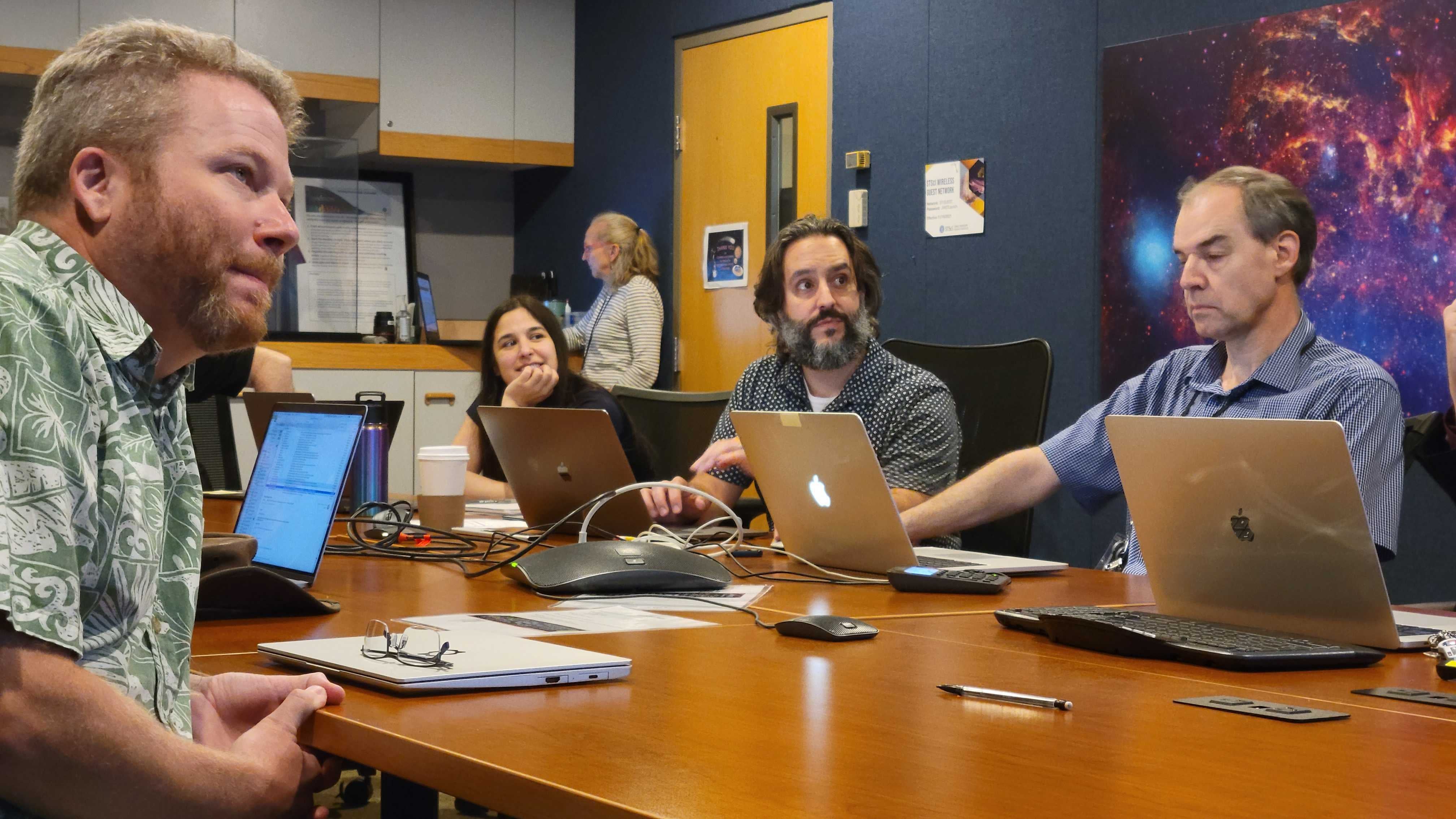 Astronomer Karl Gordon, science visuals developers Alyssa Pagan and Joseph DePasquale, and astrophysicist Anton Koekemoer discuss Webb Telescope image processing at the Space Telescope Science Institute in Baltimore.