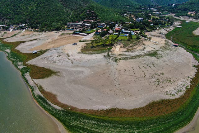 <p>A view of The Boca reservoir that supplies water to the northern city of Monterrey is almost dry as the northern part of Mexico is affected by an intense drought, in Santiago, Mexico, Saturday, July 9, 2022</p>