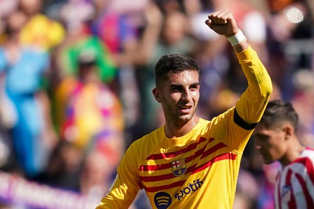 Barcelona’s Ferran Torres celebrates after scoring against Atletico Madrid (Joan Mateu/AP)