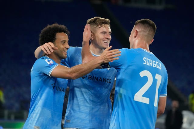 Lazio’s Toma Basic (centre), celebrates after scoring his goal against Sassuolo (Gregorio Borgia/AP/PA)