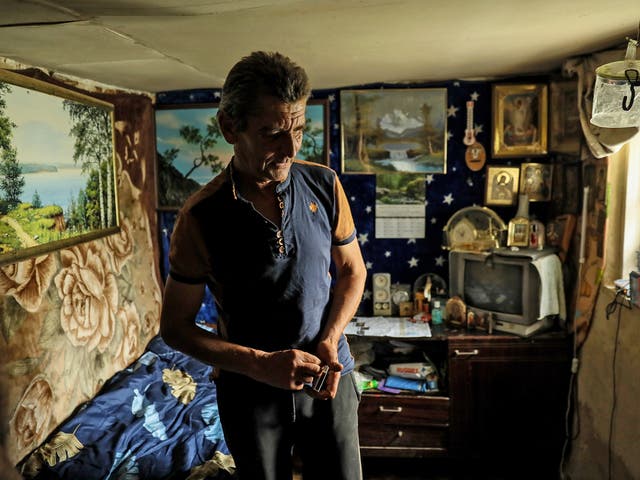 <p>Mykola, 58, stands in his house in Bohorodychne village</p>