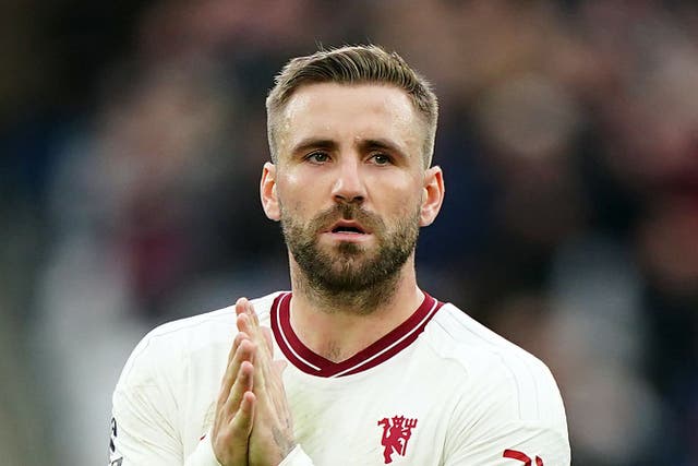 Luke Shaw (right) applauds the fans after the defeat at West Ham (Zac Goodwin/PA)