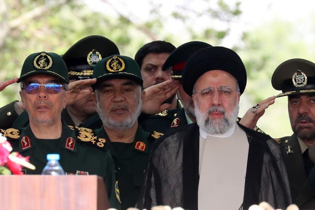 <p>File: Iranian President Ebrahim Raisi (3-L) flanked by Iranian IRGC and Army generals arrives during the annual Army Day at a military base in Tehran </p>