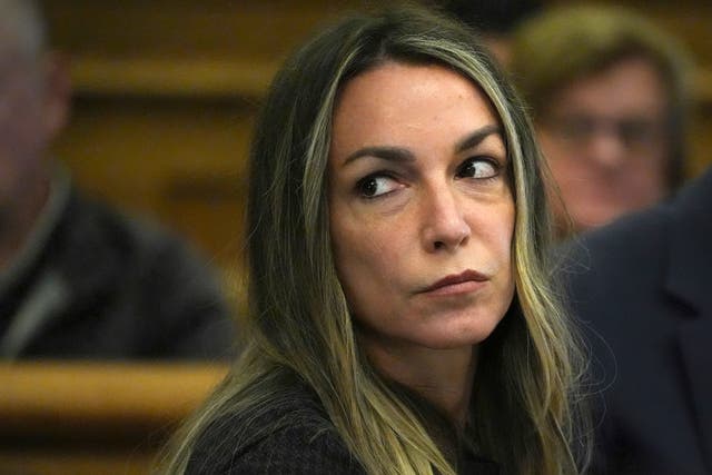 <p>Defendant Karen Read sits at the defence table during her murder trial on 20 April 2024</p>