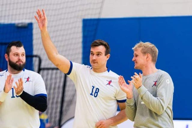 Ben Tyler, centre, shares his love of sport with his patients (England Handball/PA)