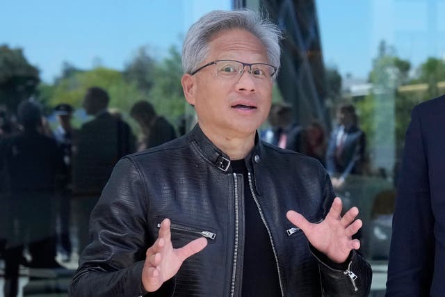 <p>Jen-hsun Huang in his trademark black leather jacket </p>