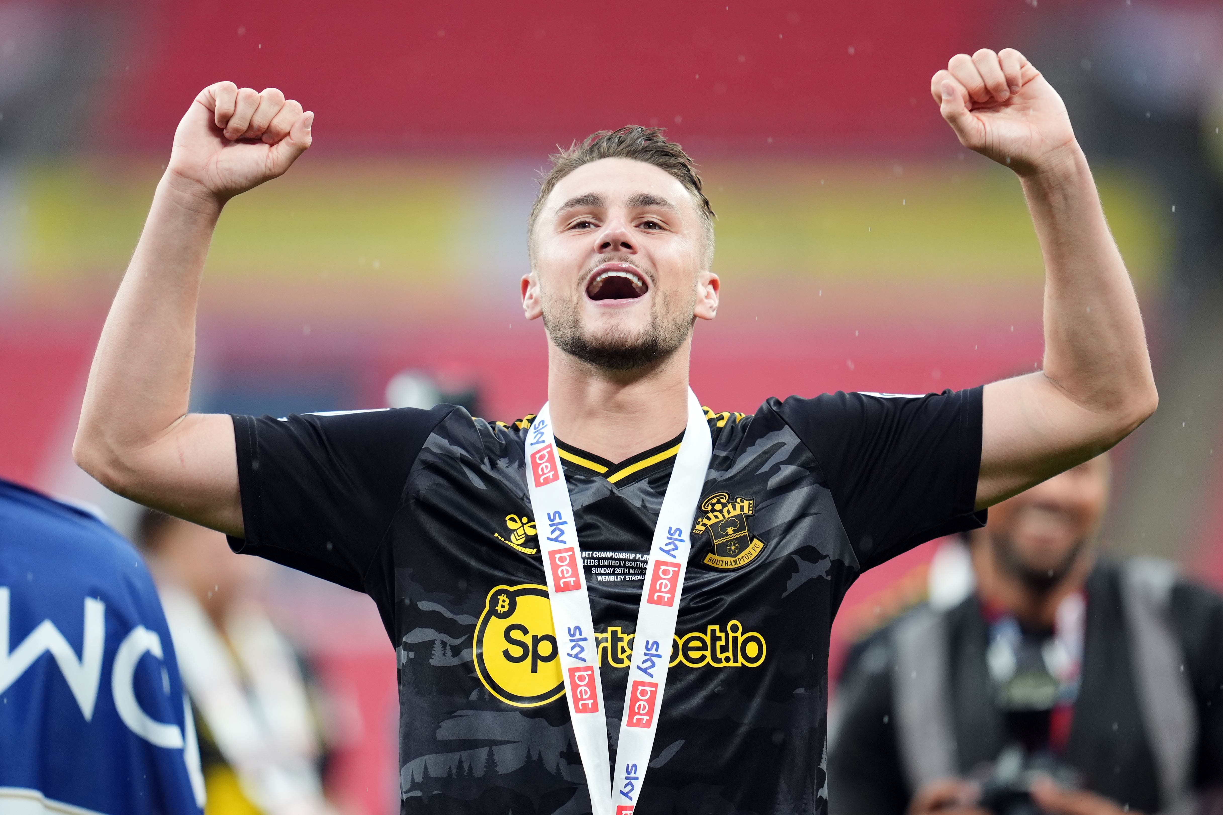 Taylor Harwood-Bellis celebrates Southampton’s promotion to the Premier League (Adam Davy/PA)