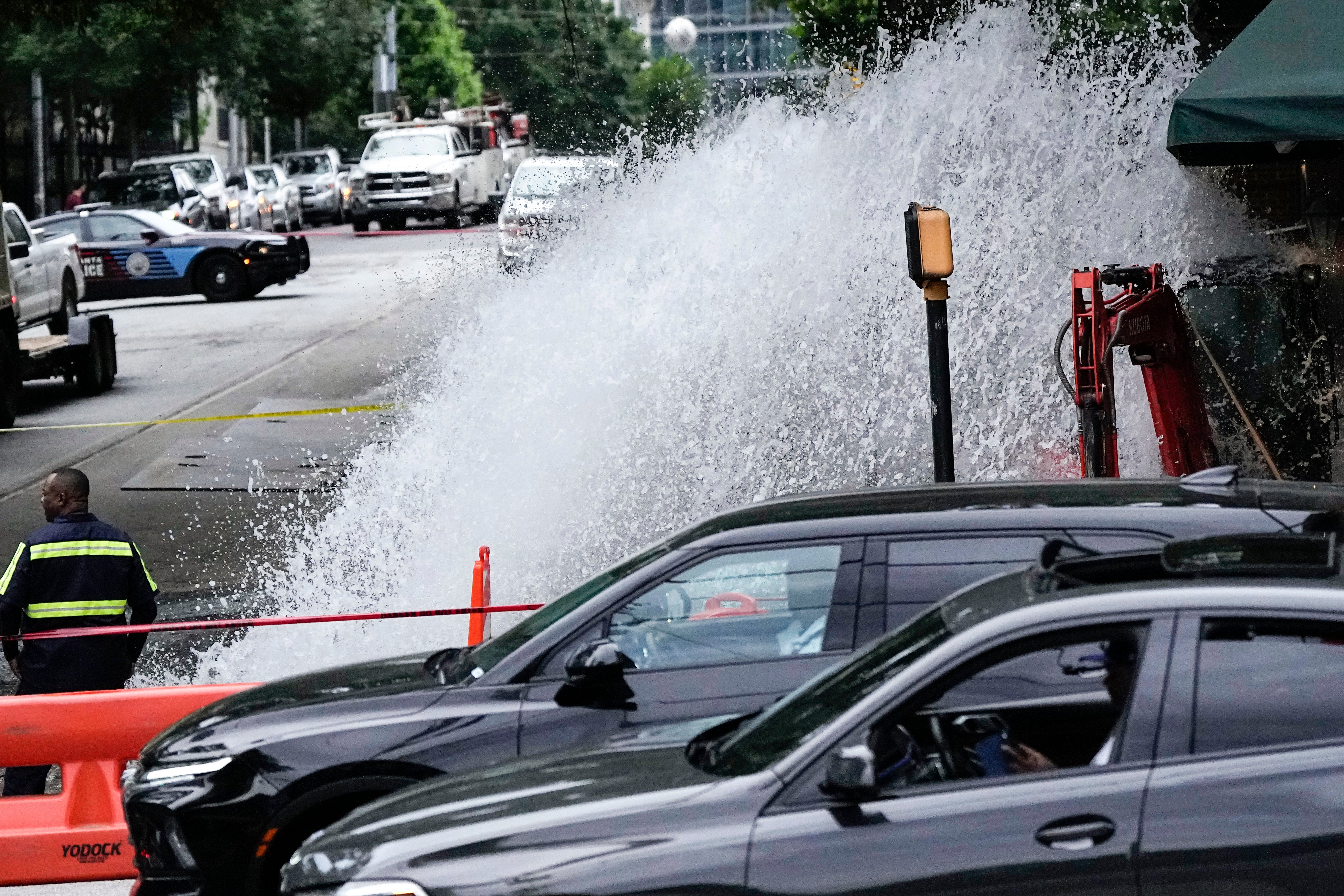 Water gushes out of a broken water transmission line in downtown Atlanta, Saturday, June 1, 2024.