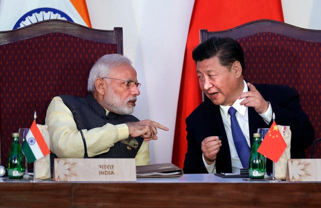 <p>Narendra Modi with Chinese President Xi Jinping at a signing ceremony by foreign ministers during the BRICS summit in 2016</p>