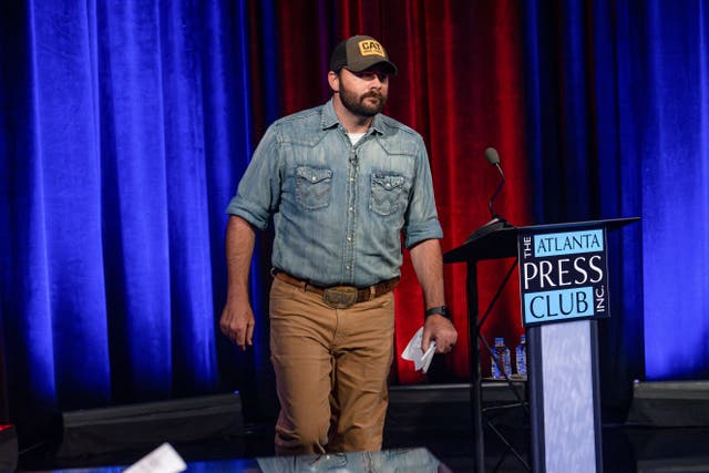 <p>Georgia Republican Chuck Hand walks out of an Atlanta TV debate with rival Wayne Johnson on Sunday June 9 2024</p>