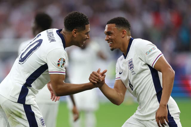 <p>Jude Bellingham, left, celebrates his goal with Trent Alexander-Arnold </p>