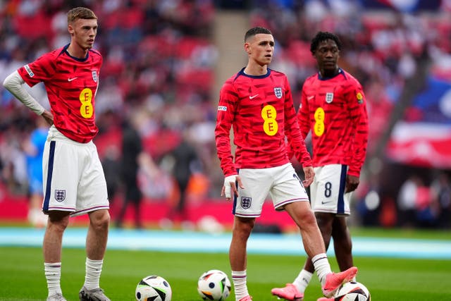 England’s Cole Palmer, Phil Foden and Kobbie Mainoo warming up before the friendly against Iceland (Mike Egerton/PA)