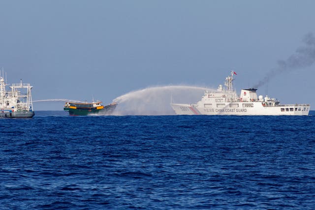 <p>File. Chinese Coast Guard vessels fire water cannons towards a Philippine resupply vessel Unaizah on its way to a resupply mission at Second Thomas Shoal in the South China Sea</p>