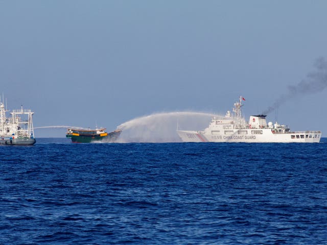 <p>Chinese coast guard vessels use water cannons against a Philippine boat on its way to resupply the military outpost on Second Thomas Shoal on 5 March 2024</p>
