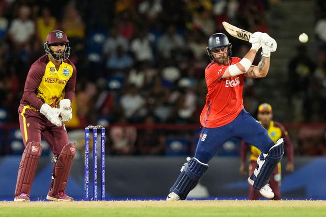 England’s Phil Salt, right, bats during the men’s T20 World Cup match against the West Indies (Ramon Espinosa/AP)