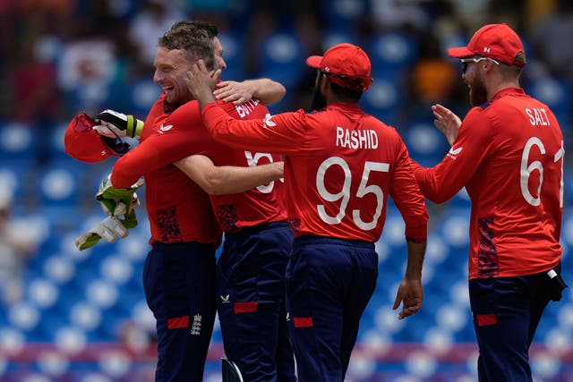 Mark Wood, left, congratulates Jos Buttler after the dismissal of Heinrich Klaasen (Ramon Espinosa/AP)