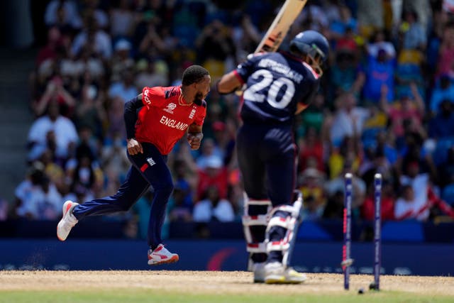 Chris Jordan, left, celebrates his hat-trick against the USA (AP Photo/Ricardo Mazalan)