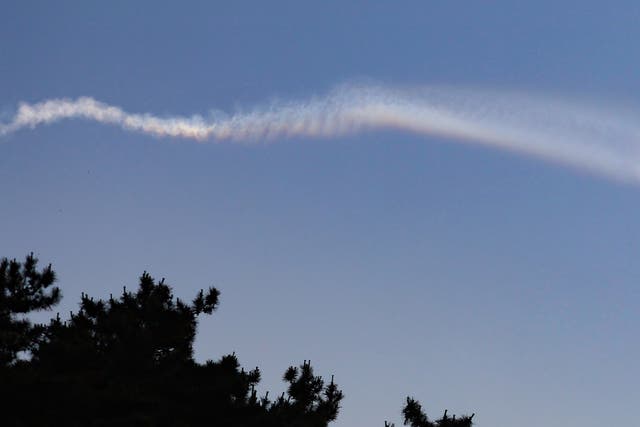 <p>A vapour trail believed to be created by a North Korean ballistic missile is seen from Yeonpyeong island near the 'northern limit line' sea boundary with North Korea </p>