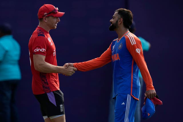 <p>India’s Virat Kohli, right, gets congratulations from Jos Buttler </p>