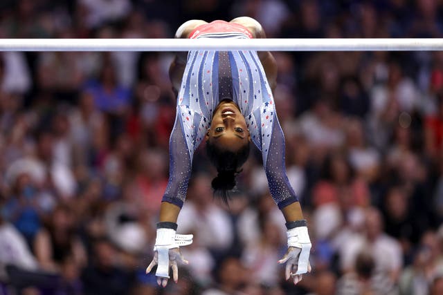 <p>Simone Biles competes on the uneven bars on Day Two of the 2024 U.S. Olympic Team Gymnastics Trials at Target Center on June 28, 2024 in Minneapolis, Minnesota</p>