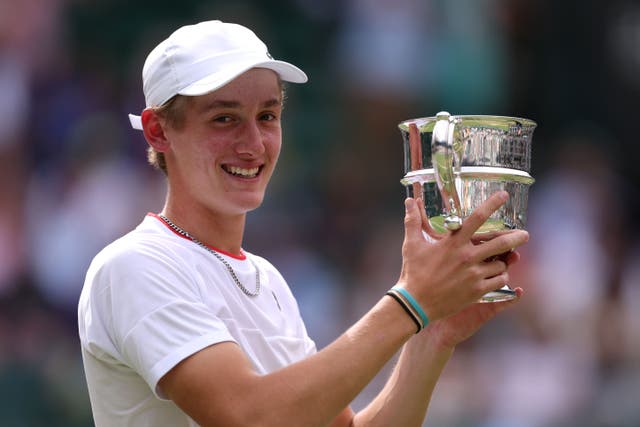 Henry Searle with the Wimbledon boys’ singles trophy (Steven Paston/PA)