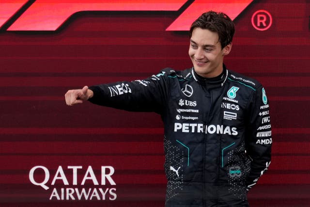 George Russell celebrates his dramatic win at the Austrian Grand Prix (Darko Bandic/AP)