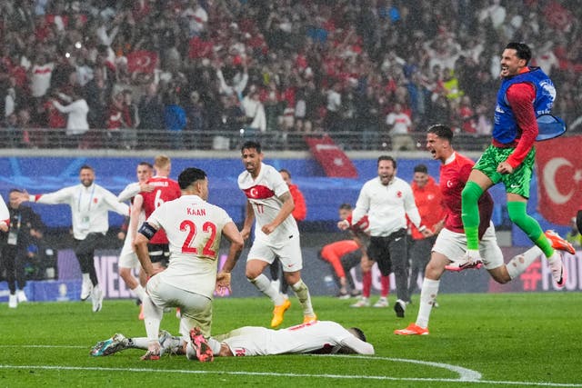 <p>Turkey players celebrate after the full-time whistle blows</p>