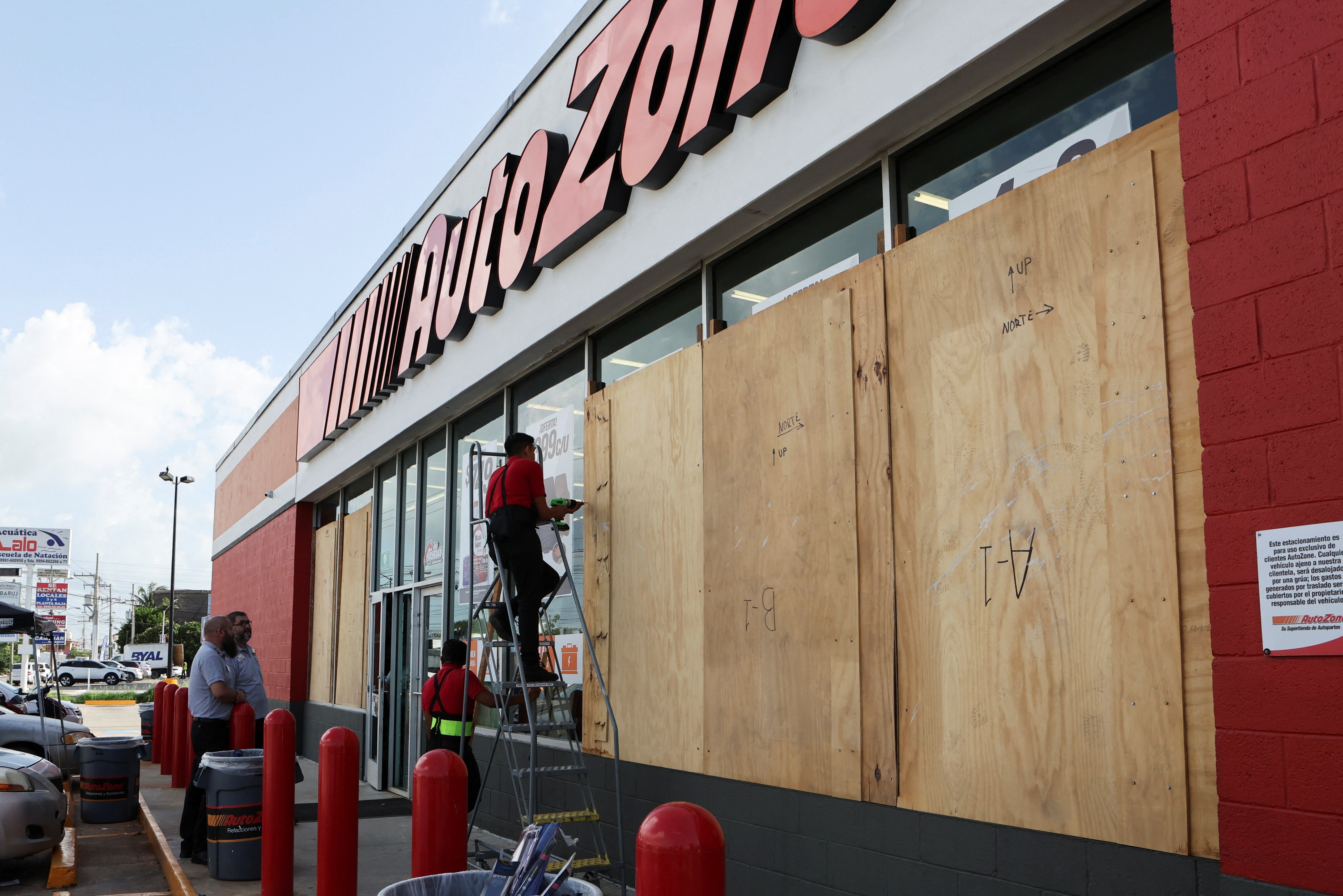 Workers board up a business to avoid damage ahead of Hurricane Beryl, in Merida, Mexico July 3, 2024