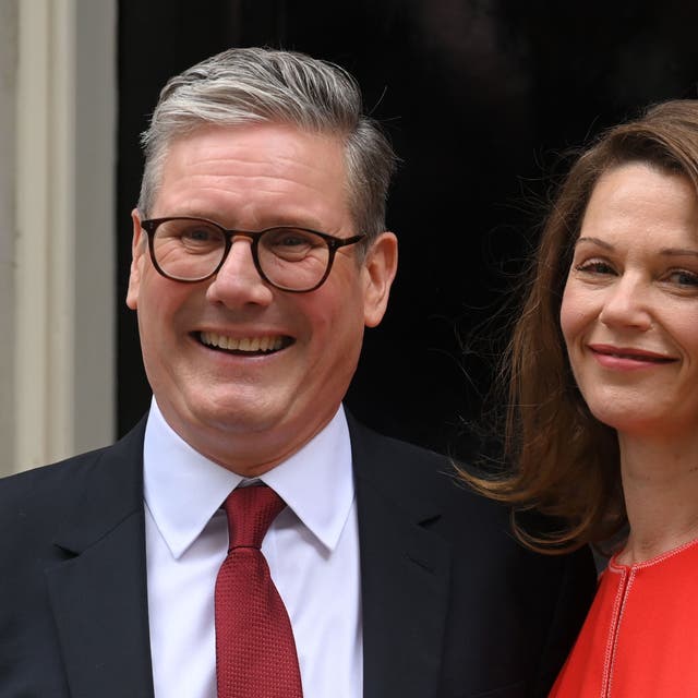 <p>Victoria Starmer standing next to her husband at their new address 10 Downing street </p>